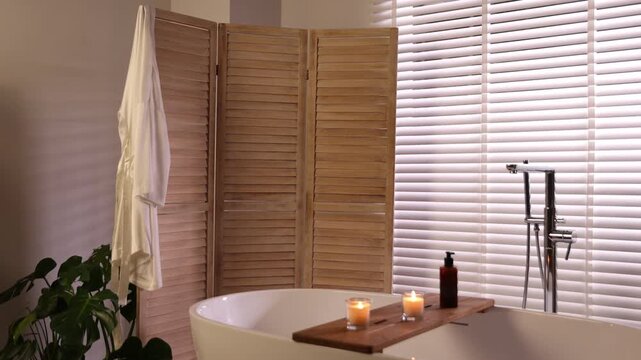 Stylish bathroom interior with folding screen and tub. Camera moving forward