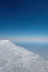 Empty Shoreline With Calm Water And Blue Sky