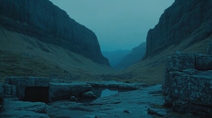 A serene mountain valley bathed in muted light.