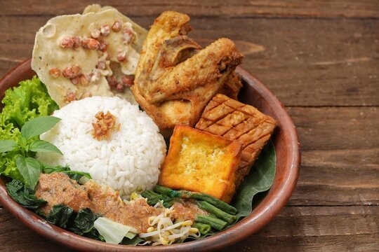 Nasi pecel or sega pecel is a typical Javanese Indonesian rice dish served with pecel.