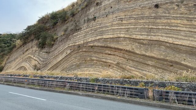 Folded Strata Road Cut and Rock Outcrop on Izu Oshima Island, Japan
