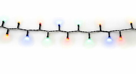 String of multicolored L E D lights on black wire against white background colorful