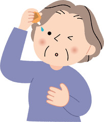 目薬を指すシニア女性
