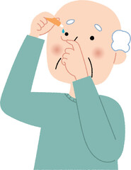 目薬を指すシニア男性