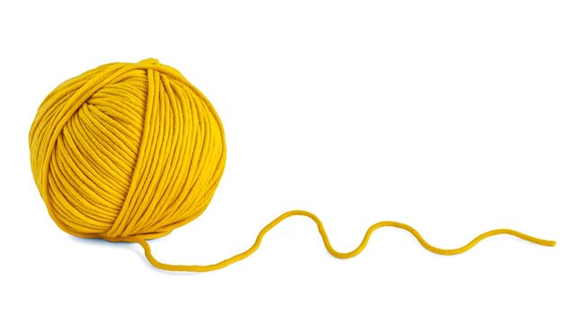 Yellow yarn ball with loose thread isolated on white
