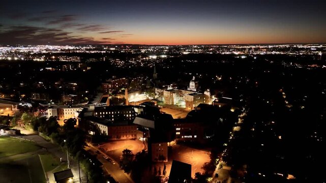 Aerial night view of University of Montreal and Vincent d Indy School of Music with illuminated campus and city lights. g.