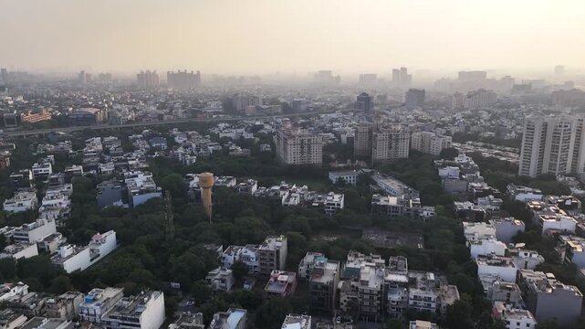 Aerial view of Gurugram dense mix of residential builder floors and lush treetops Developing urban grid. haze a natural "depth-of-field" effect where the background disappears into a toxic mist.