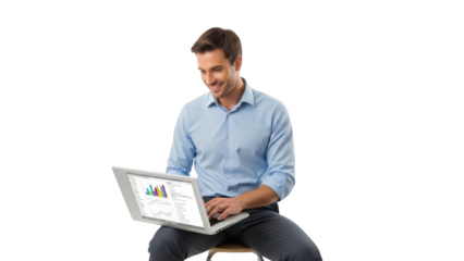 A man sits on a stool, working on a laptop displaying colorful graphs and charts in a relaxed, casual environment.