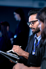 Future AI strategy talk. Male visionary leader explains ethical AI implementation or market disruption plan to female strategist surrounded by futuristic data screens.
