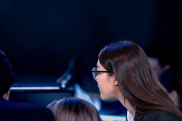 Overtime grind. Focused team tackles complex project late night in modern tech hub view over shoulder showing code intense digital workplace productive collaboration.