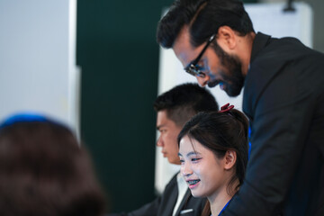 Code refinement power session. Focused female developers analyze complex script colleague points stylus critical logic fix discussed screen glows late night agile sprint push mode on now.