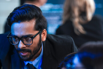 Deep code analysis huddle late night. Senior developer points out intricate logic colleague absorbs critical details screen reflects complex script intense debugging session proceeds now code work.