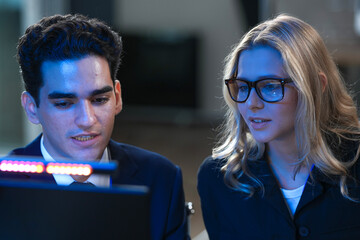 Onboarding future skills now. Experienced lead guides new talent navigating complex AI interface screen shows advanced data streams accelerated learning immersive tech hub build mode activated go.