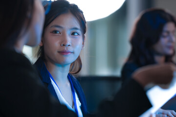 Monitoring AI training progress. Specialists oversee a machine learning model's training observing...