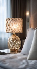 Gold lamp on bedside table, soft light, white bedding