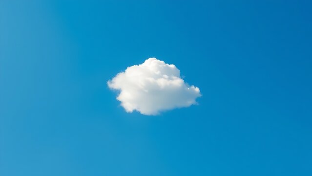 Single fluffy cloud in a vast blue sky, serene atmosphere.