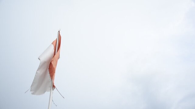 Indonesian flag. weathered flag in the wind