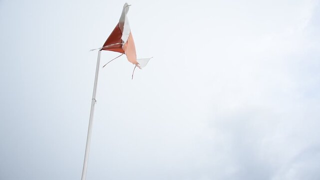 Indonesian flag. weathered flag in the wind