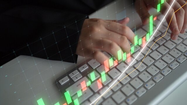 A focused trader interacts with a computer keyboard, analyzing stock market data represented by a digital candlestick chart. This image captures the essence of trading and financial analysis. Copula - Powered by Adobe