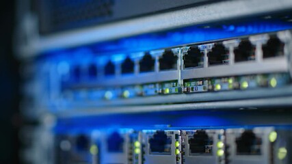 Close up of server rack with network switch and lights indicating data flow in a technology data center. - Powered by Adobe