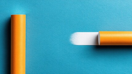 Close Up of Brown Paper Roll Tube on Teal Background with Shimmering Glitters and Bright Lighting Minimalist and Geometric Composition