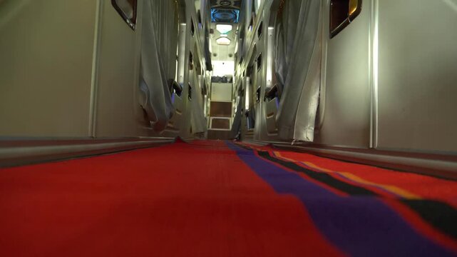 Interior of a colorful Vietnam sleeper bus showing cozy sleeping berths