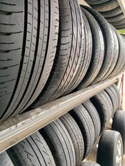 Rows of car tires in a car spare parts workshop