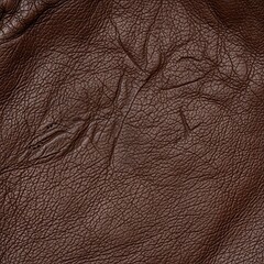 Fototapeta premium Close-up of Rich Brown Leather Texture Showing Fine Grain and Wrinkles
