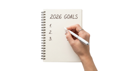A hand writes goals for the year 2026 in a notebook, AI, PNG