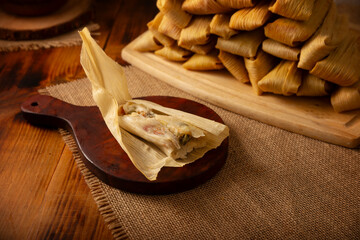 Tamales. Traditional dish typical of Mexico and some Latin American countries. Corn dough wrapped in corn leaves. The tamales are steamed.