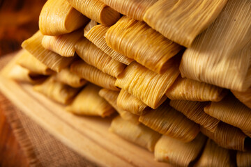 Tamales. Traditional dish typical of Mexico and some Latin American countries. Corn dough wrapped in corn leaves. The tamales are steamed.