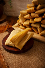 Tamales. Traditional dish typical of Mexico and some Latin American countries. Corn dough wrapped in corn leaves. The tamales are steamed.