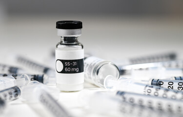 Close up of SS31 Glass Vial with Single Use Syringe