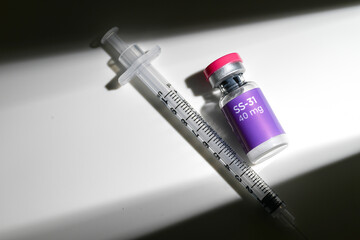 Close up of SS31 Glass Vial with Single Use Syringe