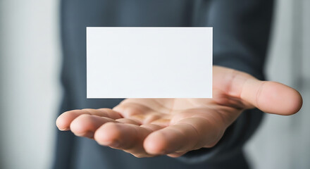 Professional Hand Presenting a Blank White Business Card for Custom Message Display and Brand Promotion with Copy Space