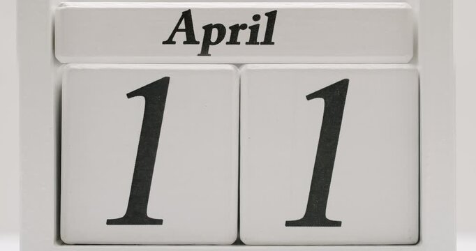 Close-up image of a block calendar set to April, representing a specific date. Ideal for marking important events, schedules, or deadlines. Close-Up of April Date on Framed Block Calendar