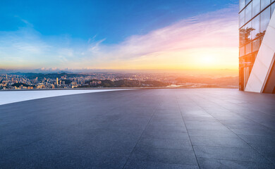 Obraz premium Empty square floor and modern city skyline with residential buildings at sunset in Shenzhen
