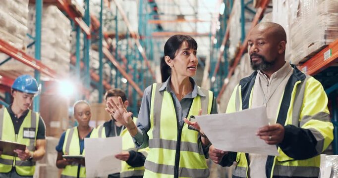 Supply chain, documents and people in warehouse, talking or logistics with storage quality control. Employees, men or women in factory, paperwork or report for inspection, export or shipping schedule