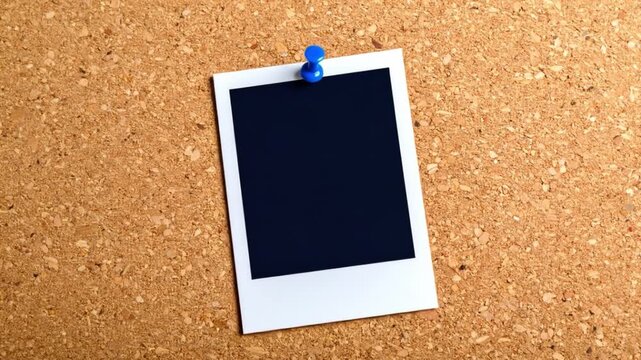 Blank polaroid photo pinned to corkboard for mockup and presentation
