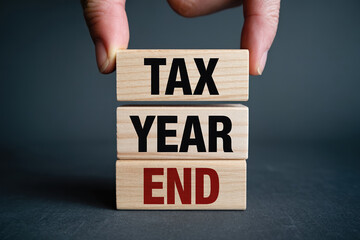 Tax year end financial deadline tax season ending with wooden blocks and business deadline
