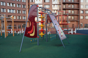Modern playground for children in courtyard. Exercise equipment