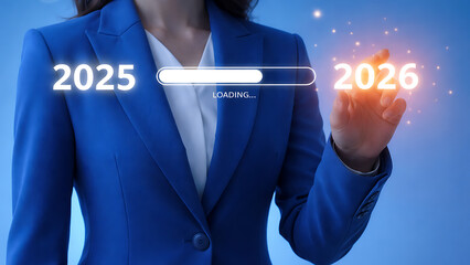 Businesswoman touching a digital loading bar transitioning from 2025 to 2026 representing technological progress and the arrival of a new year in industry