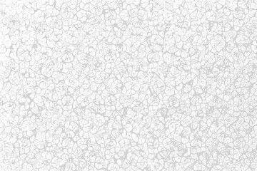 Obraz premium A densely patterned monochromatic background composed of many small swirling shapes