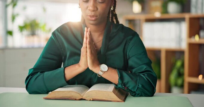 Black woman, hands and praying with bible for faith, christianity or religion in home. Female person, prayer and belief with hope or book of god for spiritual connection, wellness or worship in house