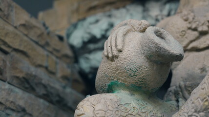 Intricate Stone Sculpture of Ancient Pot with Detailed Texture and Artistic Design