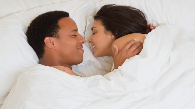 Having a mixed-race sexual partner is popular among zoomers today: a girl enjoys her mixed lover in bed
