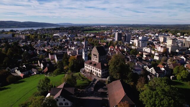 Flying around Uster castle with the city in background, Switzerland
