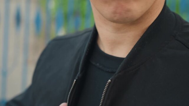 artist prepares for performance, creative individual equips themselves as lights illuminate stage, artist swiftly puts on their jacket while awaiting stage lights to brighten moments
