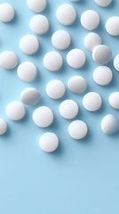 White pills on blue background, pharmaceutical medicine concept