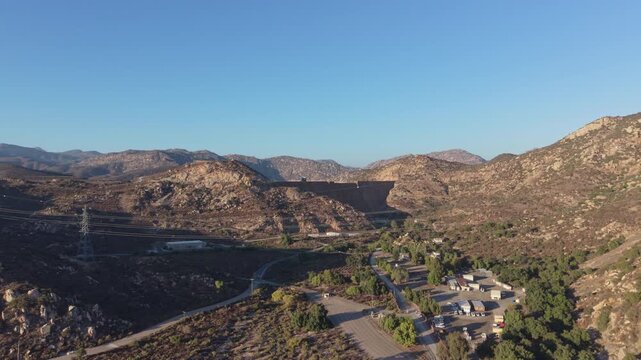 Aerial view of San Vicente Dam and Reservoir and Dam near Lakeside, California. Wide ascending drone shot.
